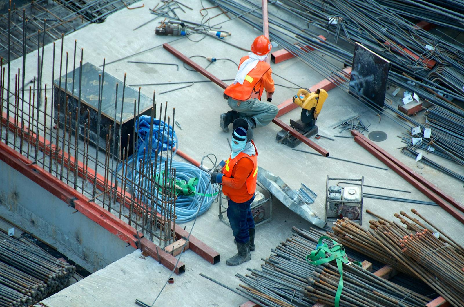 Construction workers coordinating site execution